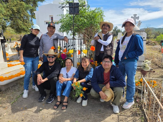 Emanuels-siblings-and-their-families-around-the-tomb-of-Melquiades-Cruz